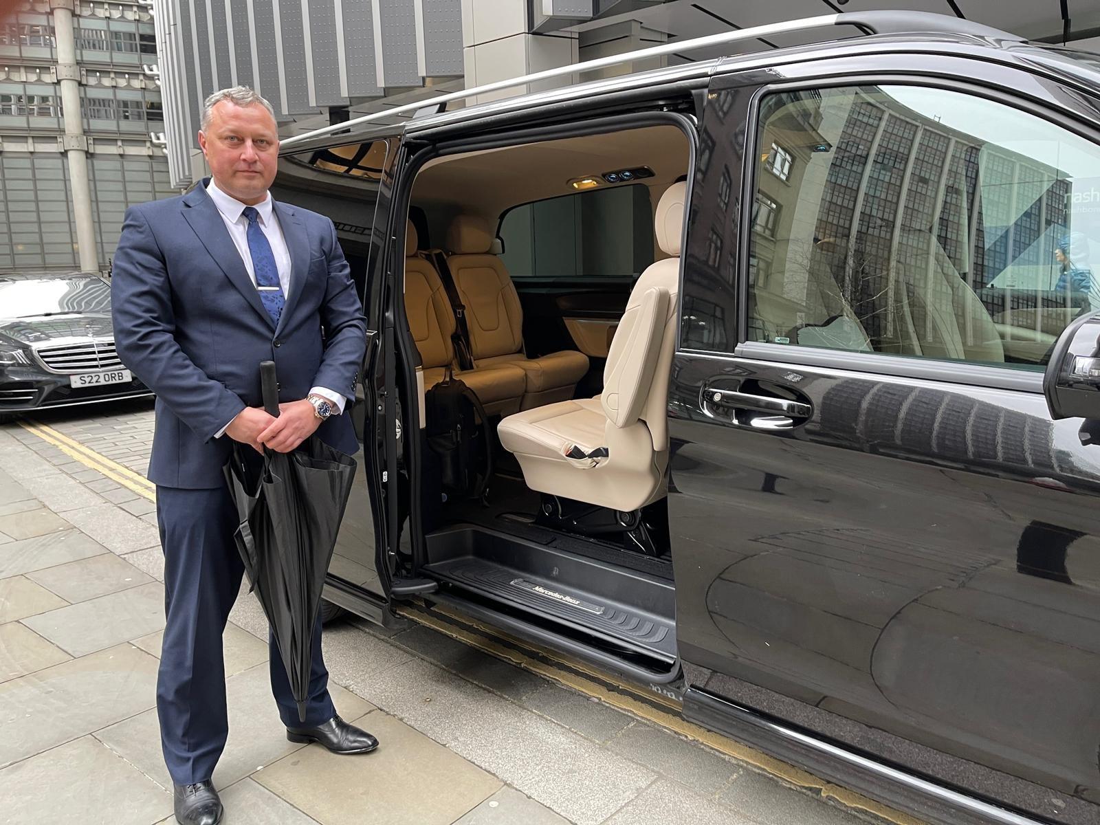 Luxury chauffeur vehicle interior used for private driver hire in London, showing premium seating and in-car amenities